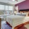 a bedroom with a bed and a fan