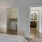 a bedroom with a bed and a mirror
