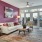 a living room with a pink wall