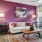 a living room with a pink wall
