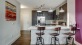 a kitchen with a bar stools