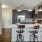 a kitchen with a bar stools