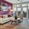 a living room with a pink wall